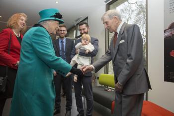 Edward Newton, aged 102, oldest surviving pupil of the Founding Hospital is presented to the Queen along with Mia, aged 14 months, one of the youngest children to be adopted through Coram
